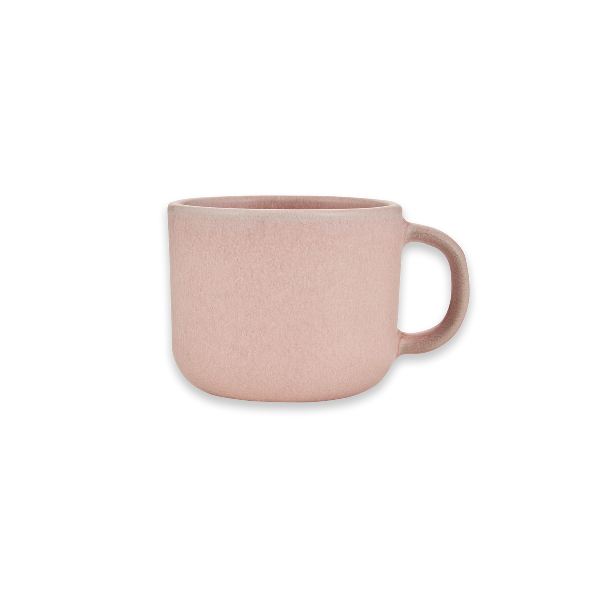 Rosa Keramik-Kaffeetasse mit Henkel rechts, minimalistisch und matt, vor schwarzem Hintergrund.