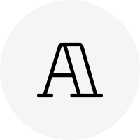Hellbeiges rundes Icon mit stilisiertem schwarzen Buchstaben A und vertikaler Linie im Querbalken.